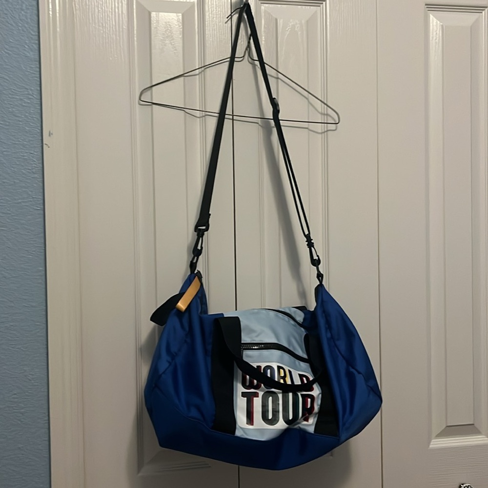 Blue and black small duffle bag. World tour Logo